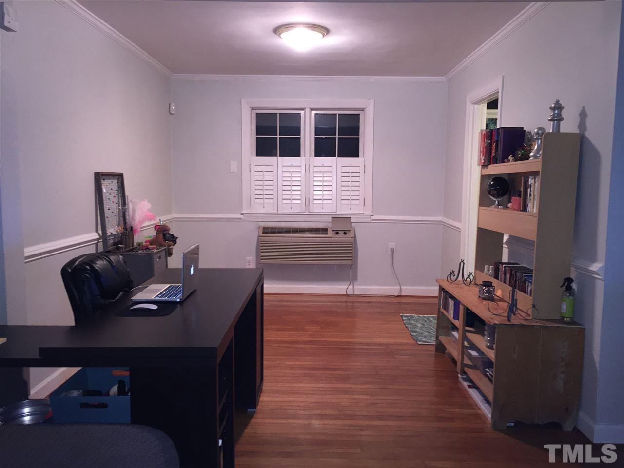 834 Bryan Street, Unit 834 Raleigh, NC 27605 - Photo 9 of 16 a view of a workspace with furniture and wooden floor