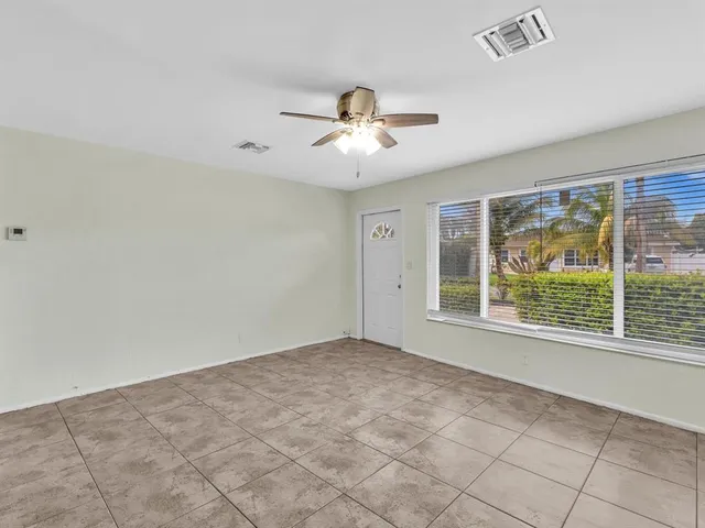 a view of an empty room with a window