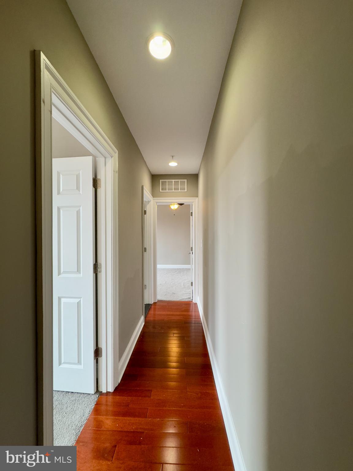 803 Cathedral Street, Unit 8 Baltimore, MD 21201 - Photo 9 of 16 a view of a hallway with wooden floor