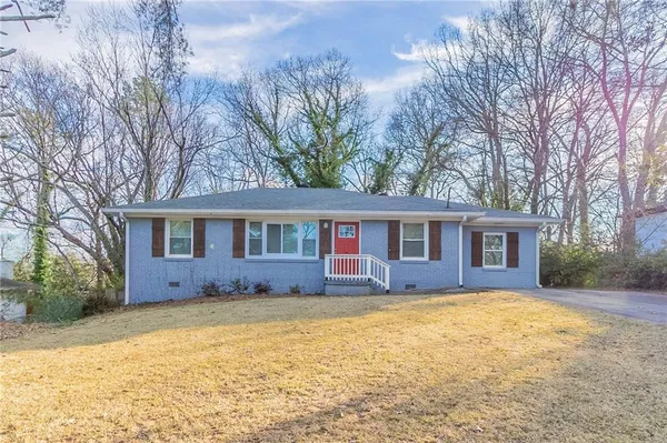front view of a house with a yard