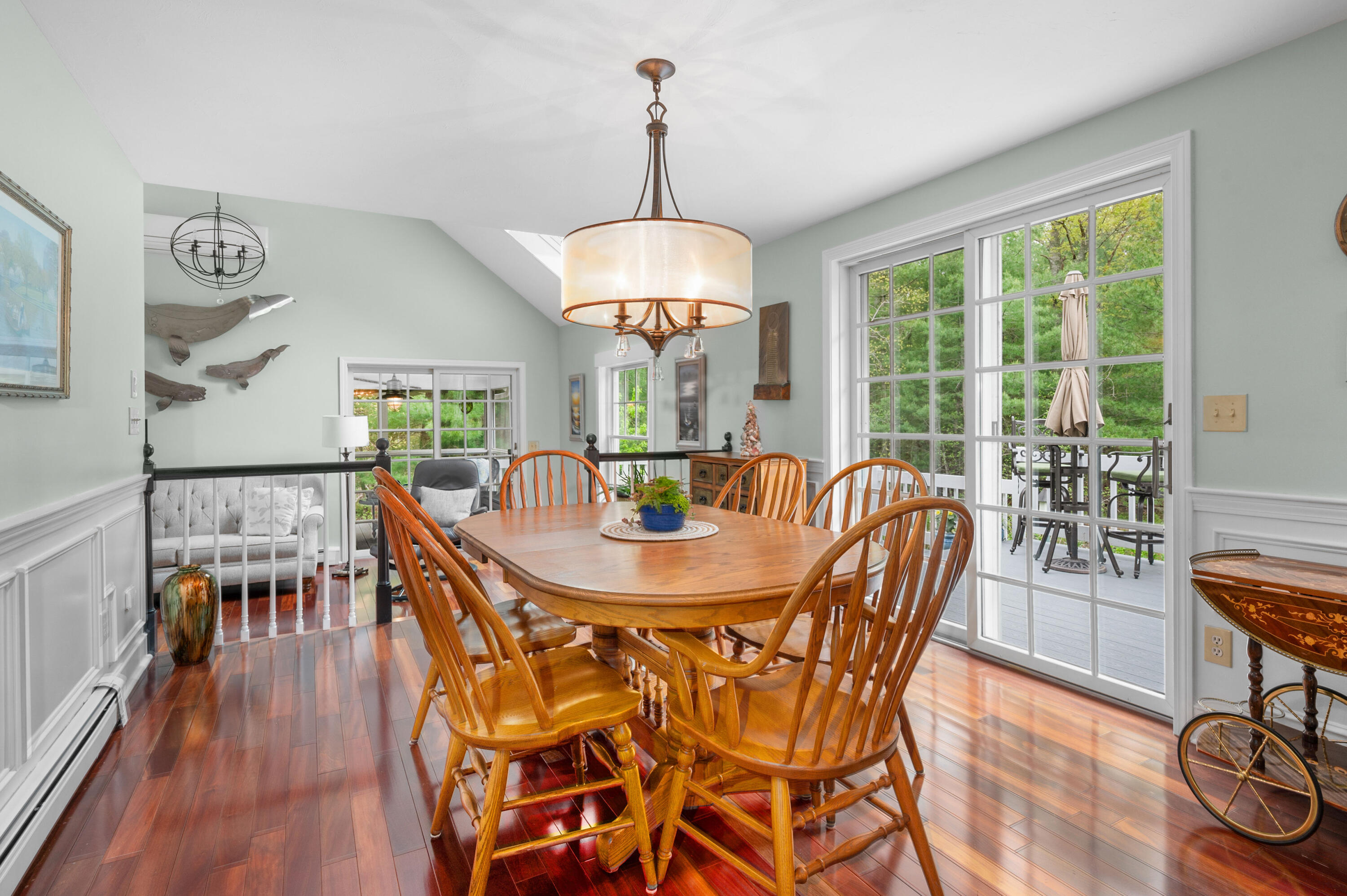 50 Hyde Park Centerville, MA 02632 - Photo 11 of 38 a dining room with furniture a chandelier and wooden floor