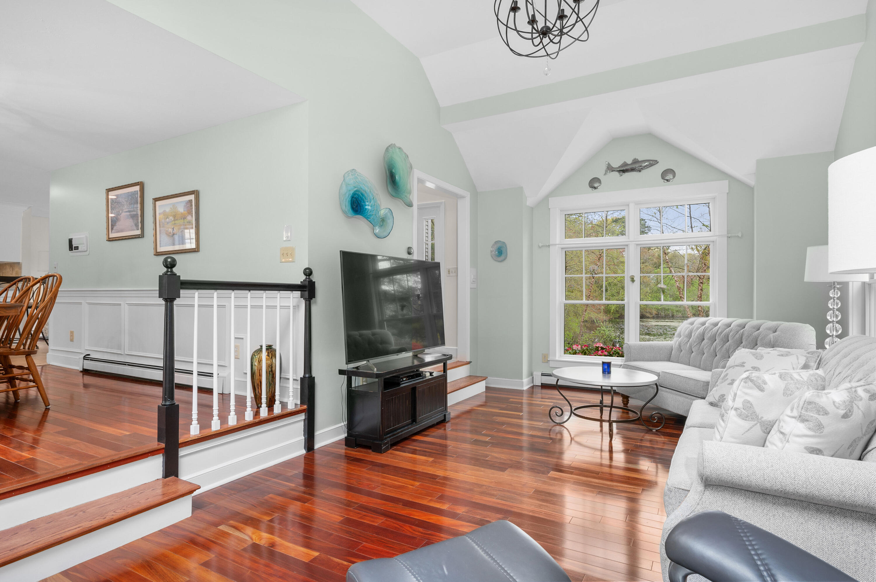 50 Hyde Park Centerville, MA 02632 - Photo 13 of 38 a living room with furniture and a flat screen tv