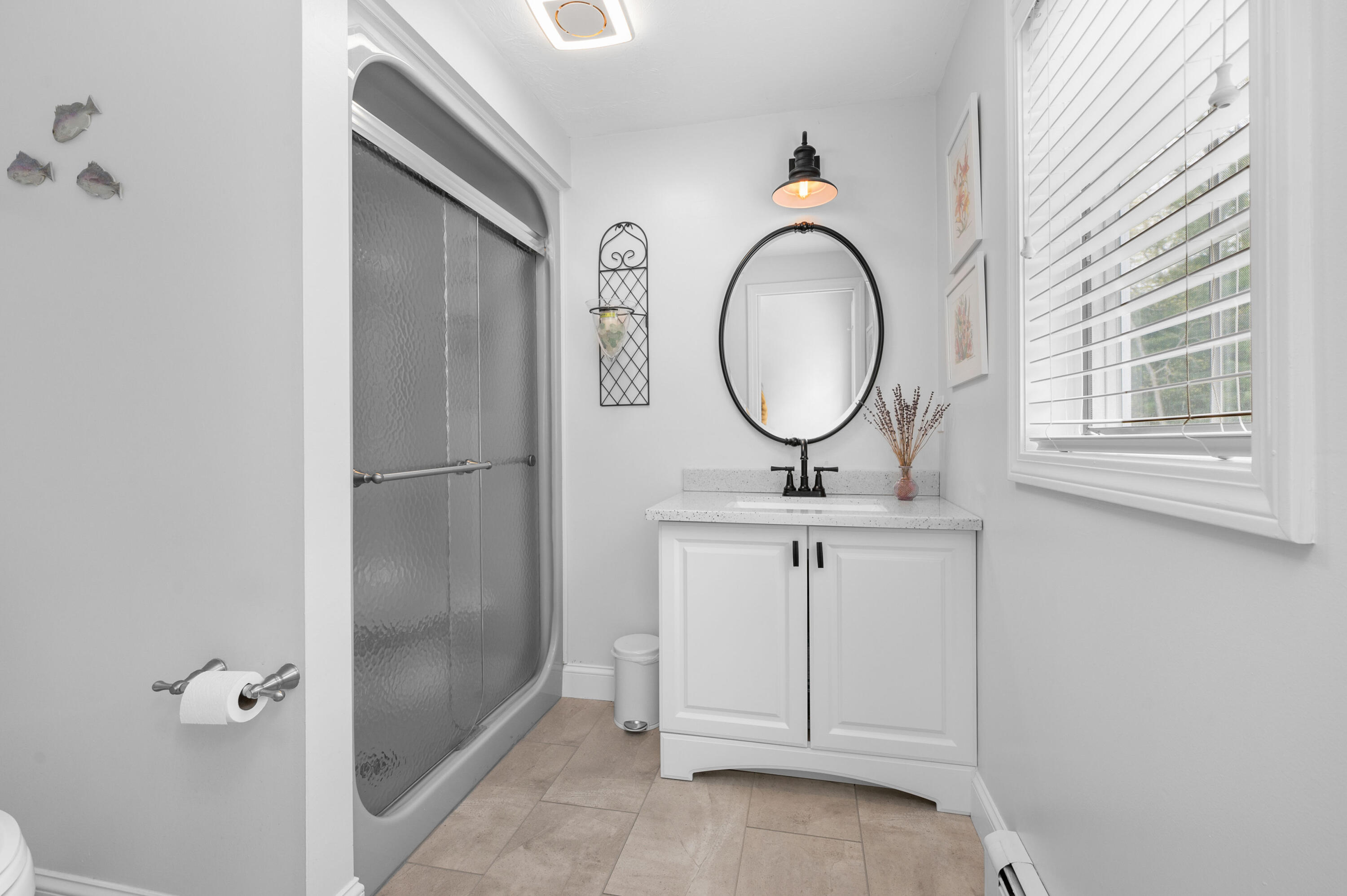 50 Hyde Park Centerville, MA 02632 - Photo 19 of 38 a bathroom with a sink and a mirror