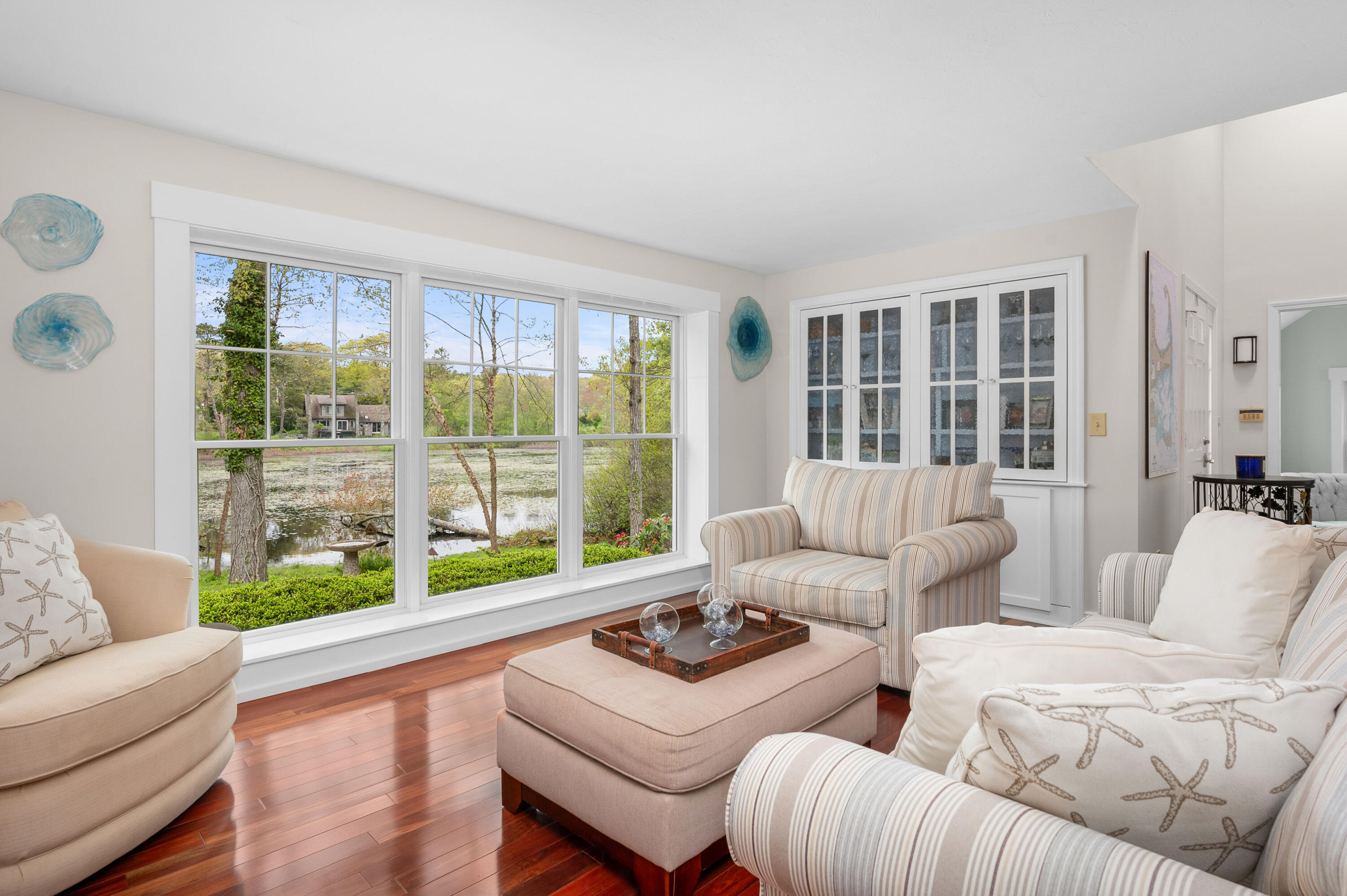 50 Hyde Park Centerville, MA 02632 - Photo 2 of 38 a living room with furniture and a large window