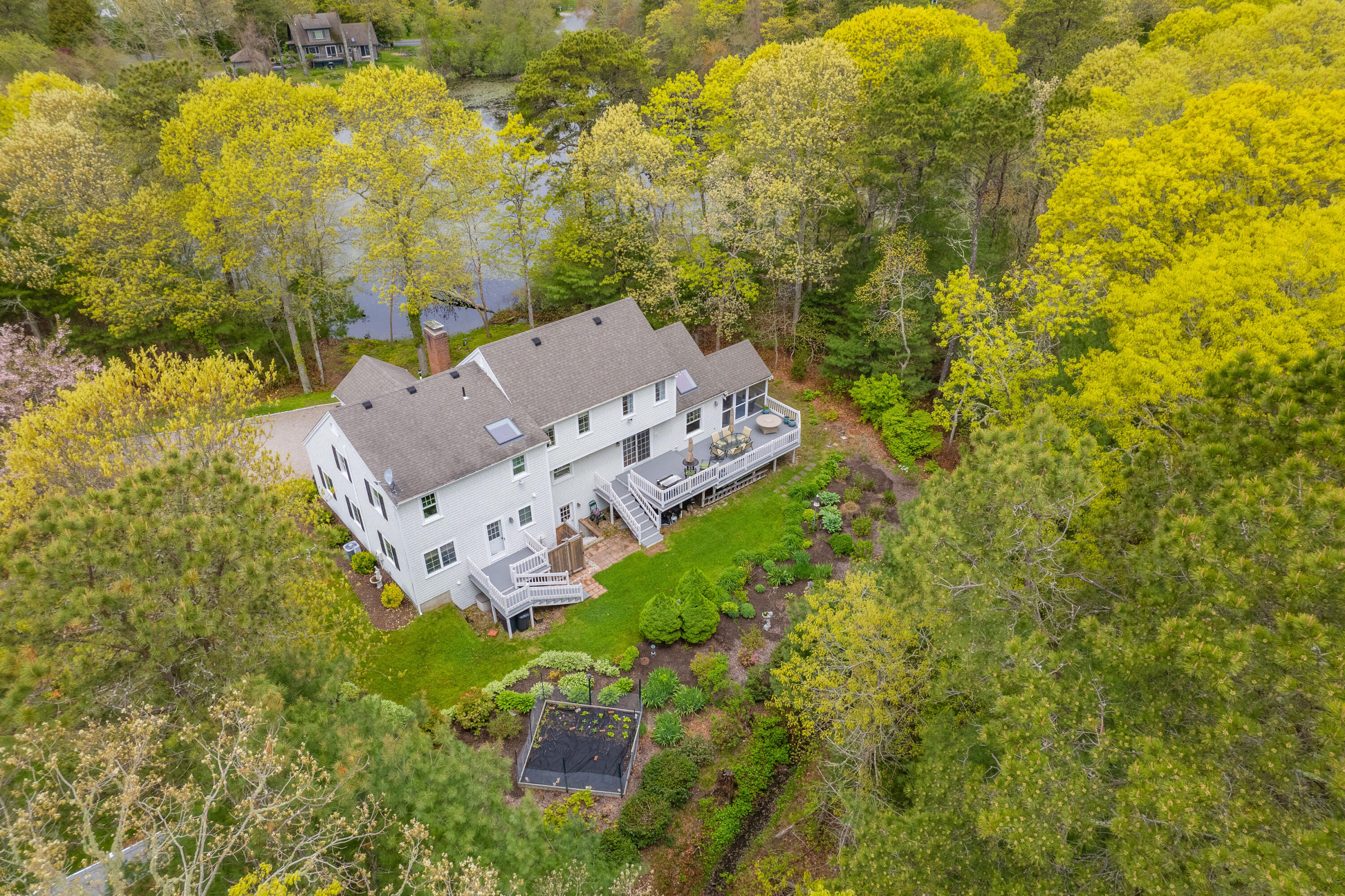 50 Hyde Park Centerville, MA 02632 - Photo 33 of 38 a aerial view of a house with a yard