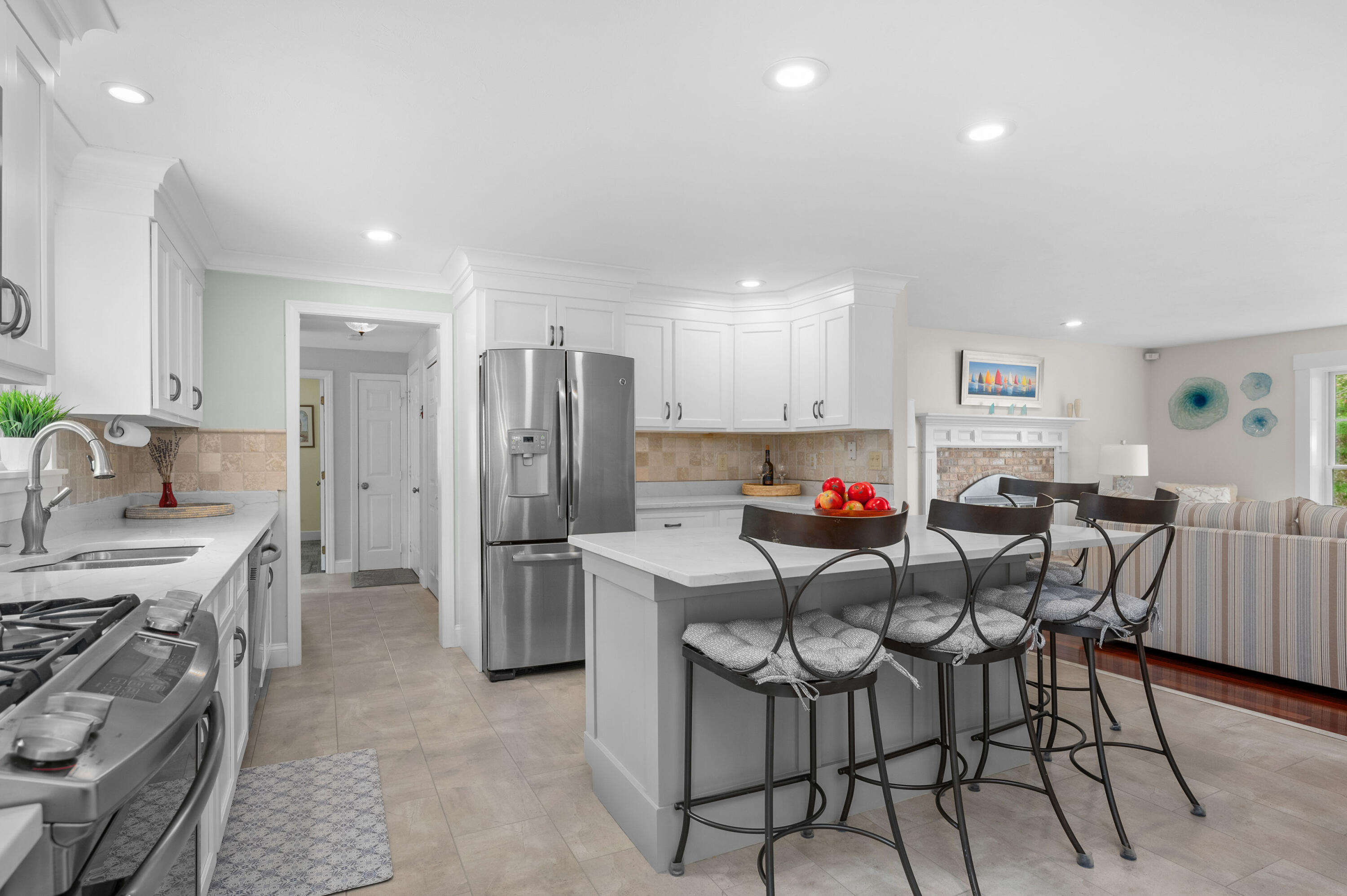 50 Hyde Park Centerville, MA 02632 - Photo 8 of 38 a kitchen with stainless steel appliances a stove a sink cabinets and a refrigerator