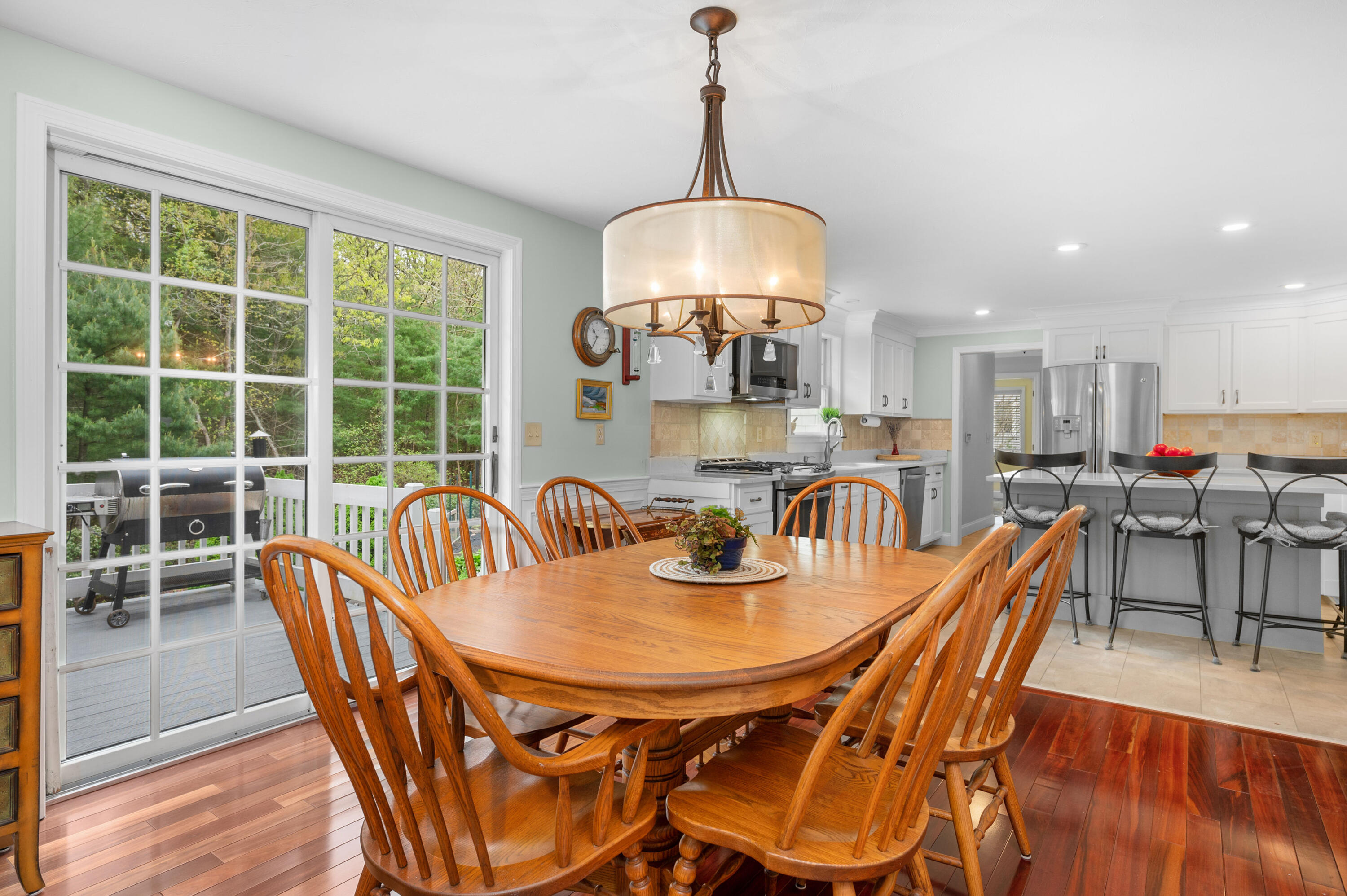 50 Hyde Park Centerville, MA 02632 - Photo 10 of 38 a dining room with furniture a chandelier and wooden floor