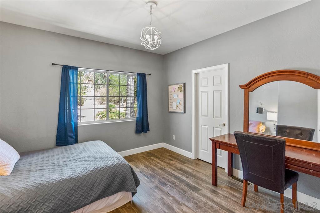 3022 Camino Del Rancho Encinitas, CA 92024 - Photo 12 of 18 a bedroom with a bed and a desk