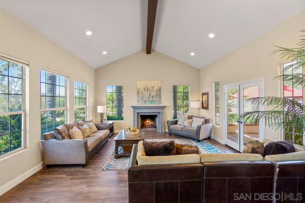 3022 Camino Del Rancho Encinitas, CA 92024 - Photo 3 of 18 a living room with furniture and a fireplace