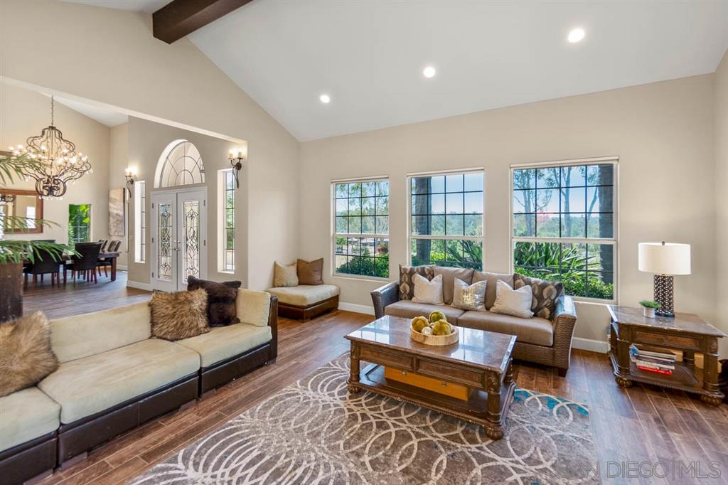 3022 Camino Del Rancho Encinitas, CA 92024 - Photo 4 of 18 a living room with furniture and a large window