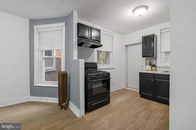 a kitchen with stainless steel appliances granite countertop a stove and a refrigerator