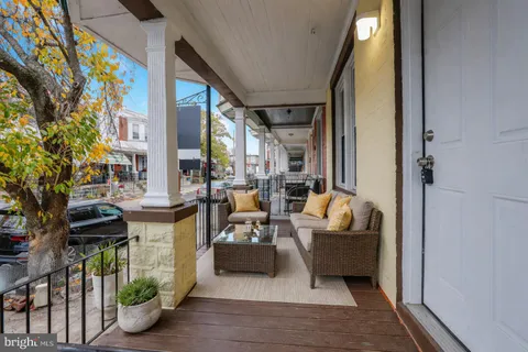 a view of a patio with couches chairs potted plants and a potted plant