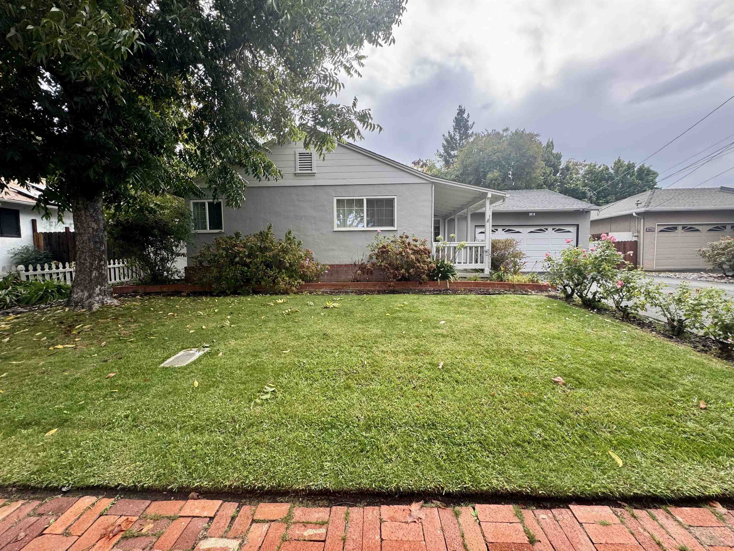 a front view of a house with garden