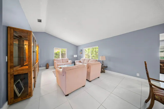 a view of a dining room with furniture and window