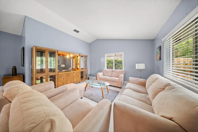 a living room with furniture and a couch