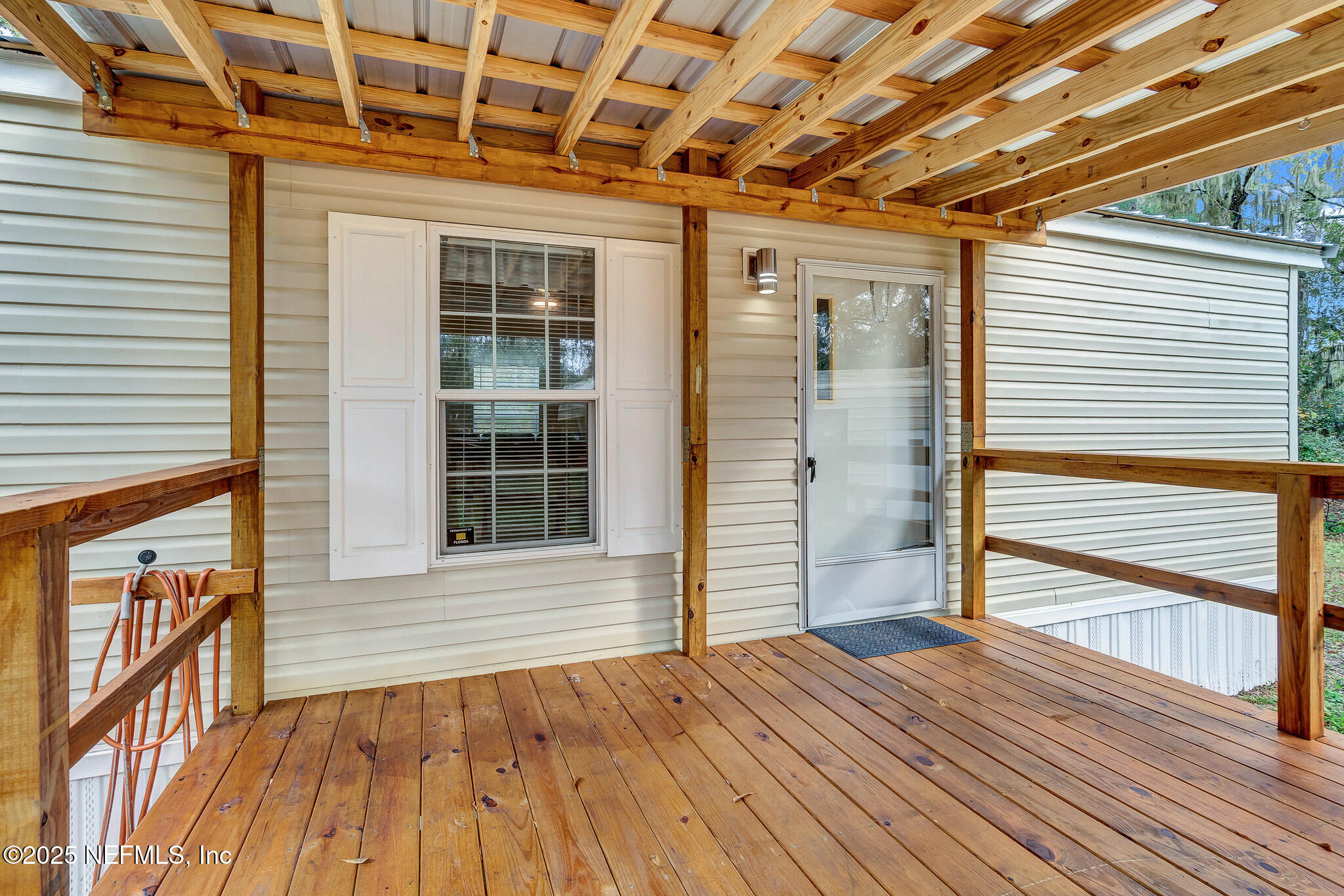 86446 Peeples Road Yulee, FL 32097 - Photo 21 of 42 a view of outdoor space with wooden floor and window