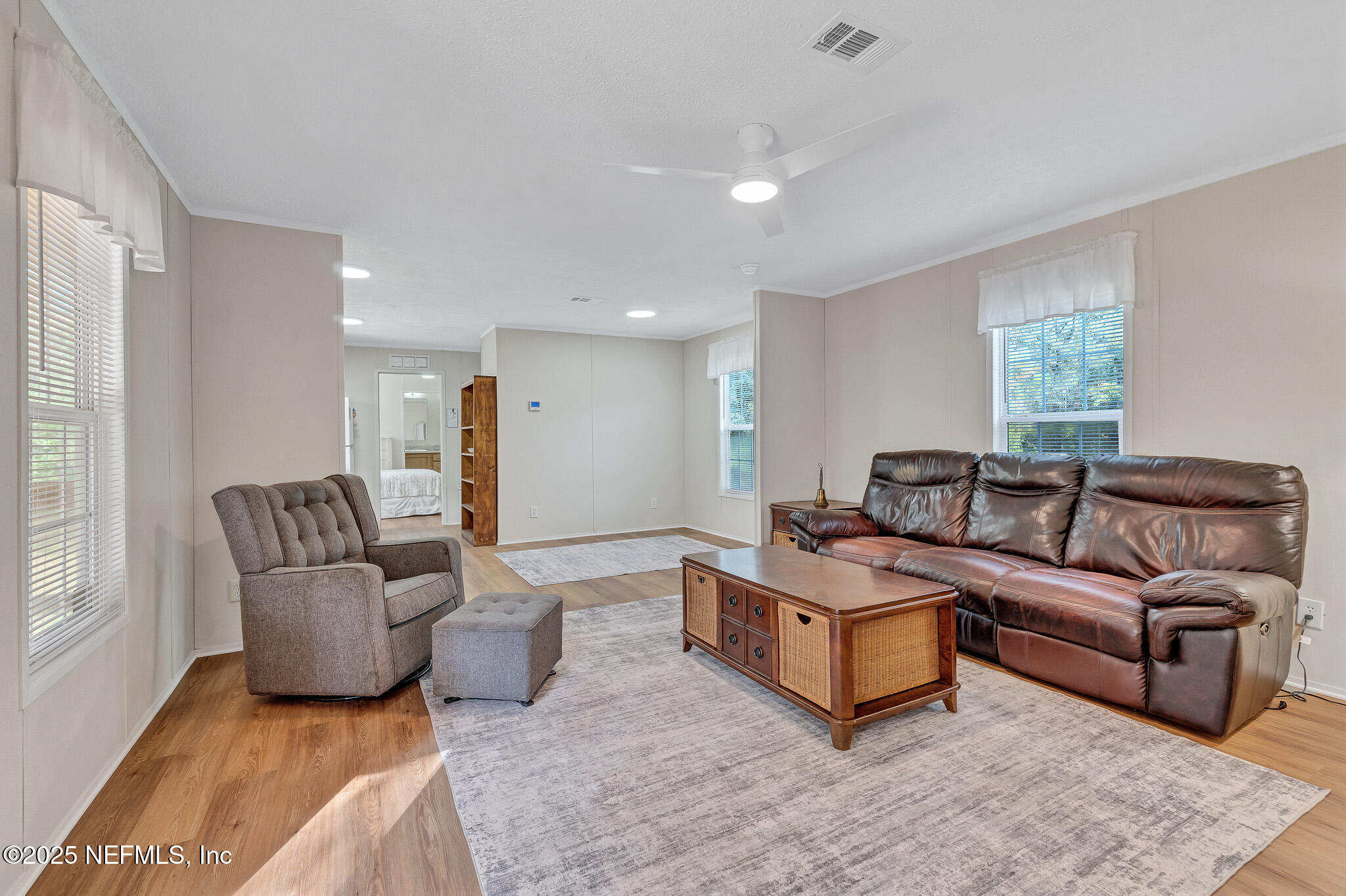 86446 Peeples Road Yulee, FL 32097 - Photo 23 of 42 a living room with furniture and a large window