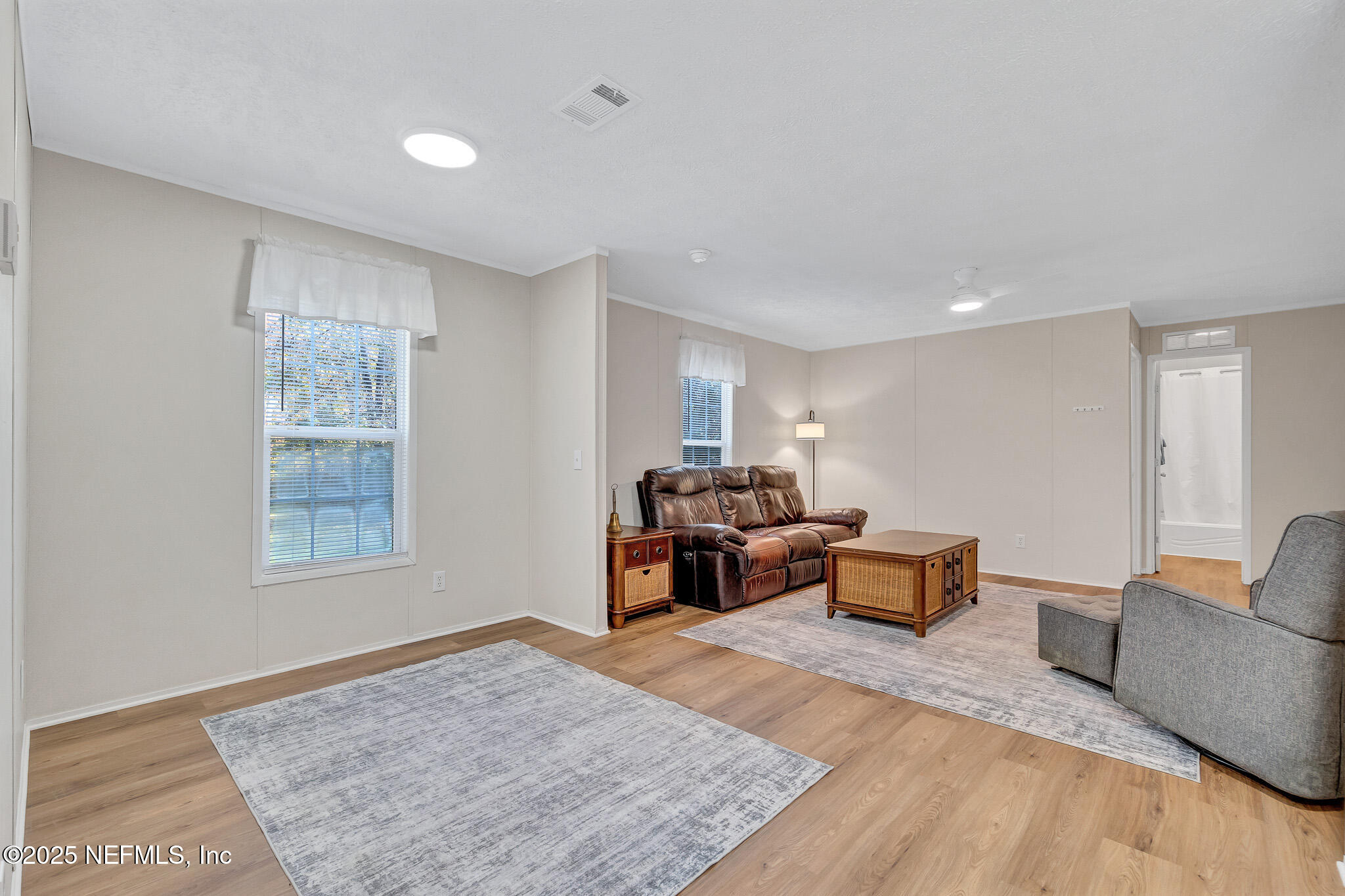 86446 Peeples Road Yulee, FL 32097 - Photo 26 of 42 a living room with furniture and a couch