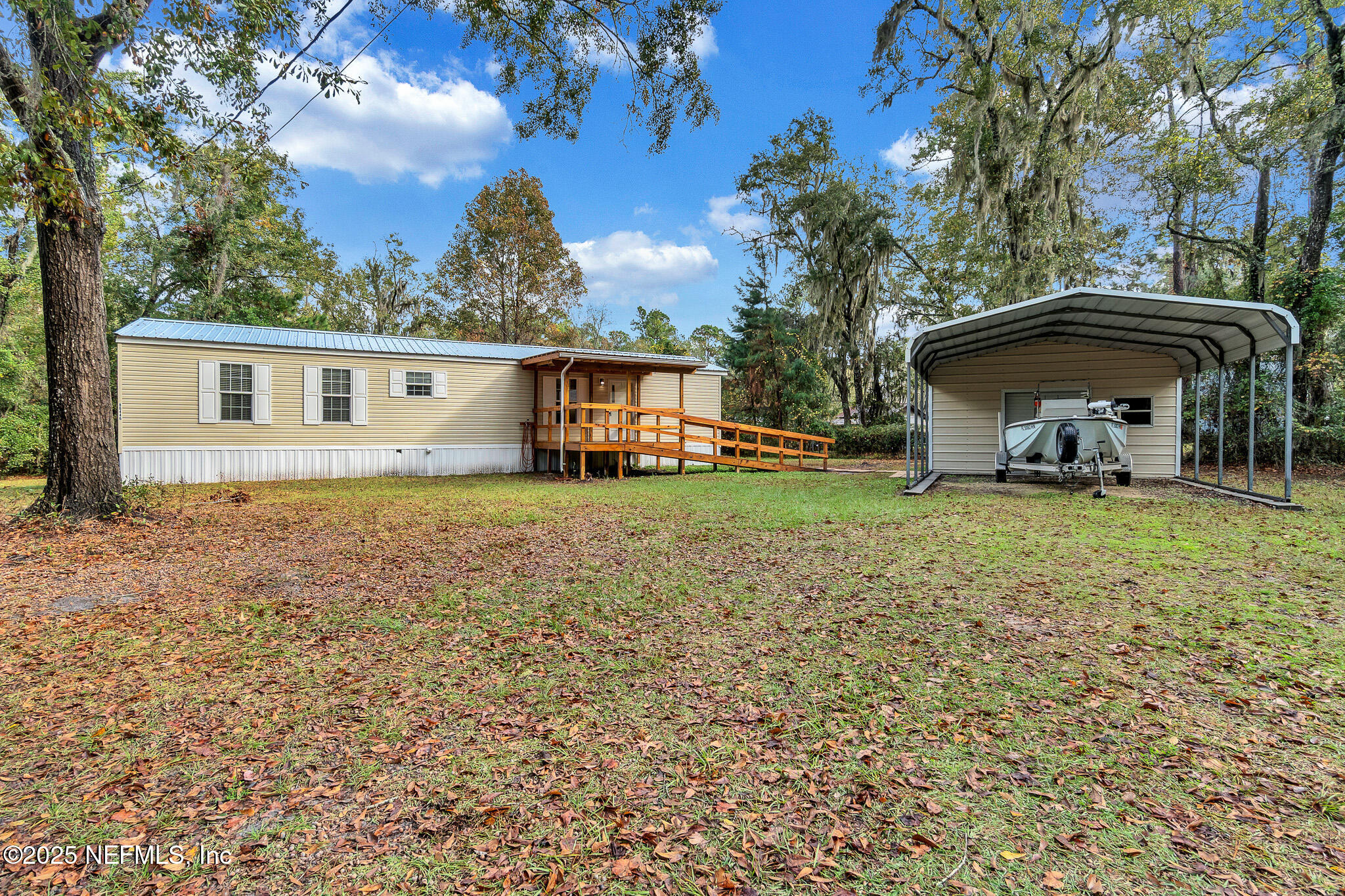 86446 Peeples Road Yulee, FL 32097 - Photo 3 of 42 front view of house with a yard