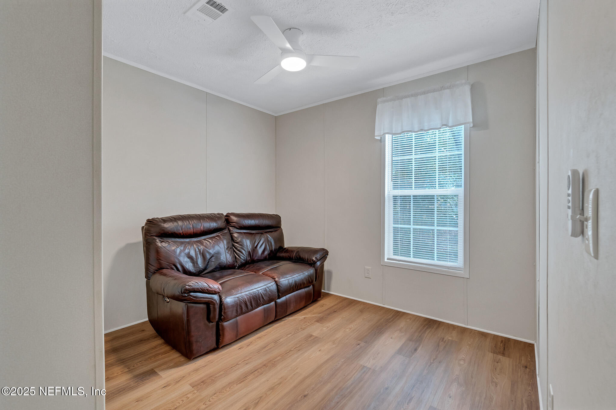 86446 Peeples Road Yulee, FL 32097 - Photo 38 of 42 a living room with furniture and a window