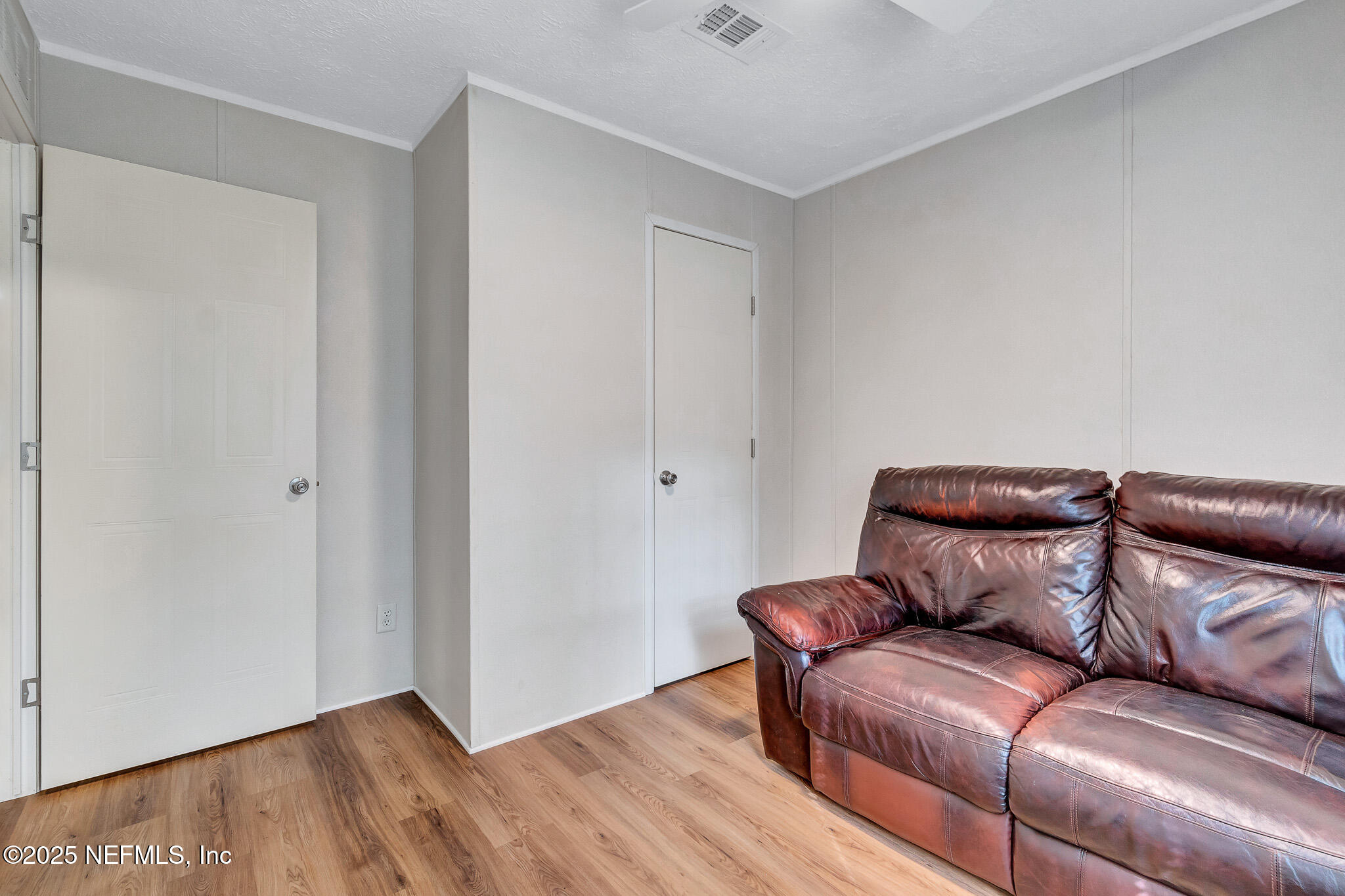 86446 Peeples Road Yulee, FL 32097 - Photo 39 of 42 a living room with furniture and wooden floor