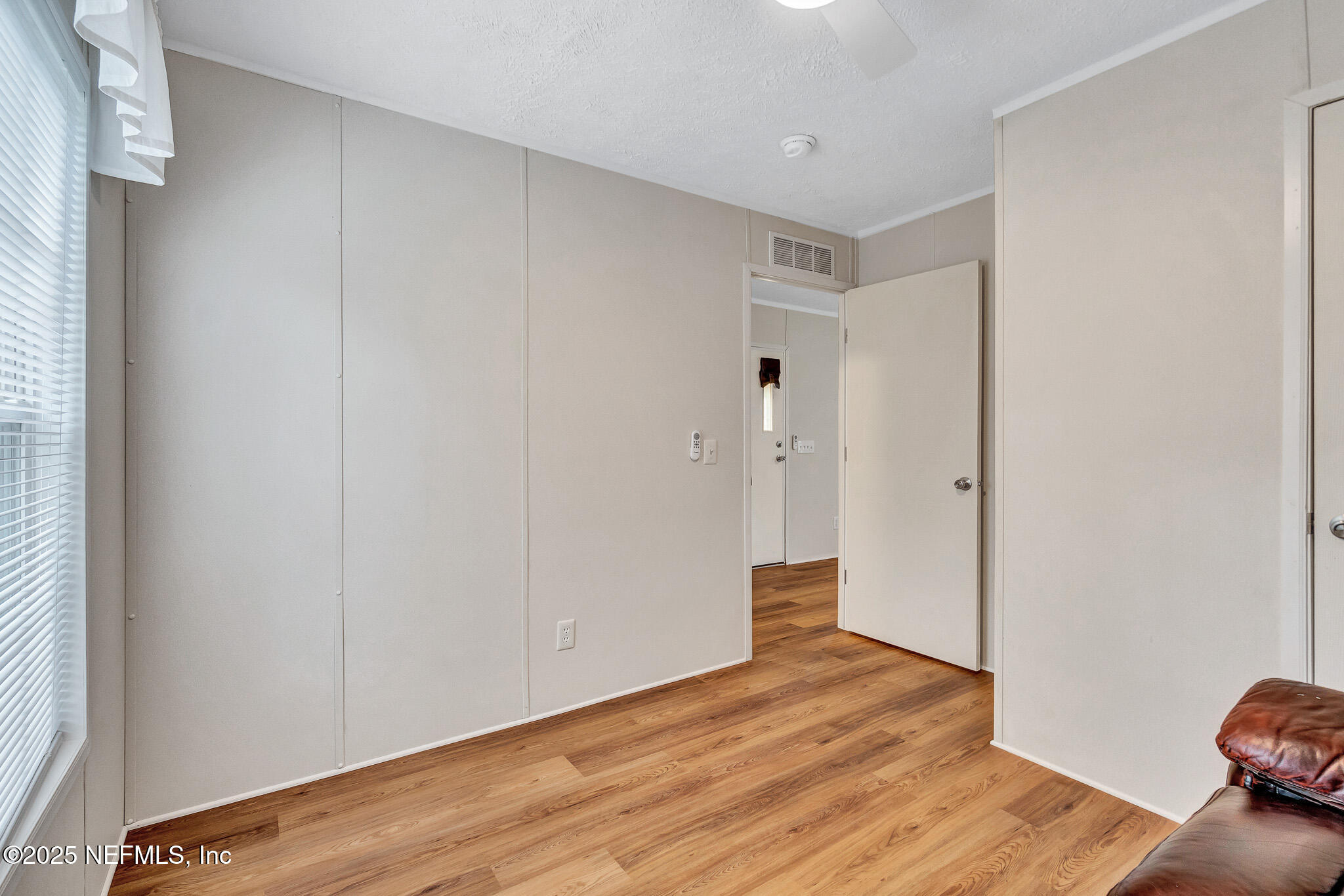 86446 Peeples Road Yulee, FL 32097 - Photo 40 of 42 a view of empty room with wooden floor