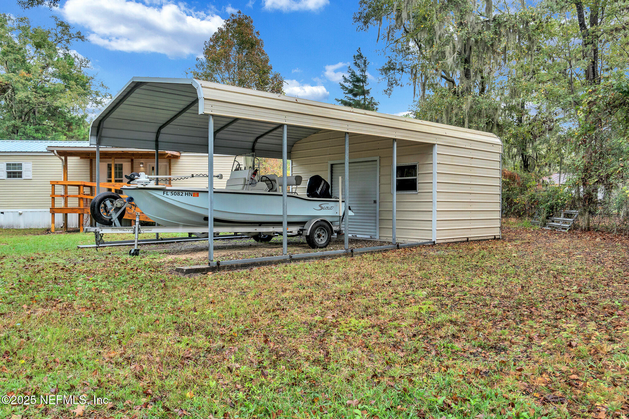 86446 Peeples Road Yulee, FL 32097 - Photo 4 of 42 a backyard of a house with yard and garage