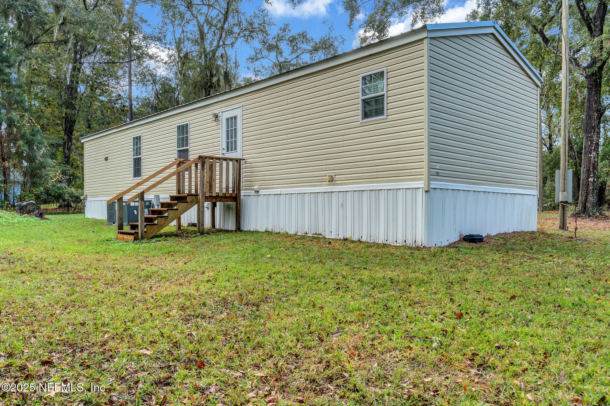 86446 Peeples Road Yulee, FL 32097 - Photo 6 of 42 a view of a house with a backyard