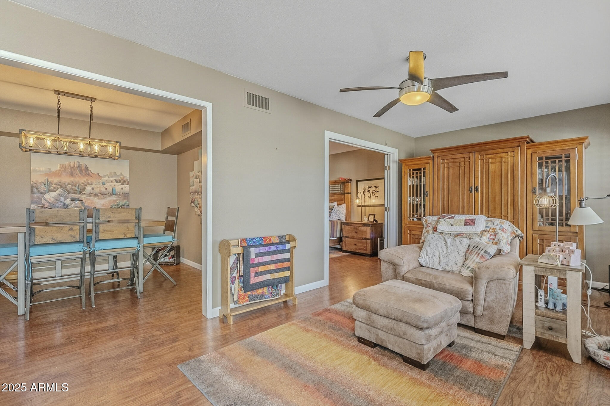 10010 West Royal Oak Road, Unit R Sun City, AZ 85351 - Photo 11 of 28 a living room with furniture and a wooden floor