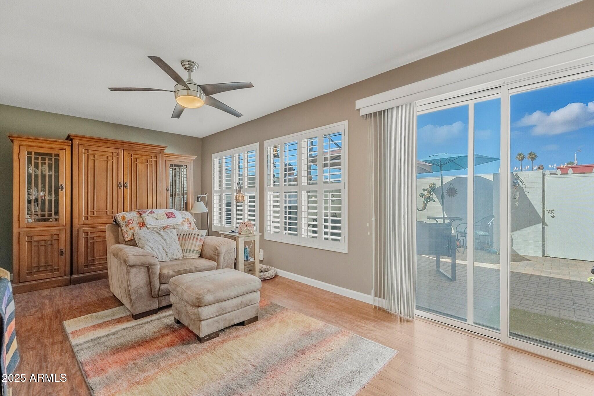 10010 West Royal Oak Road, Unit R Sun City, AZ 85351 - Photo 12 of 28 a living room with furniture and a large window