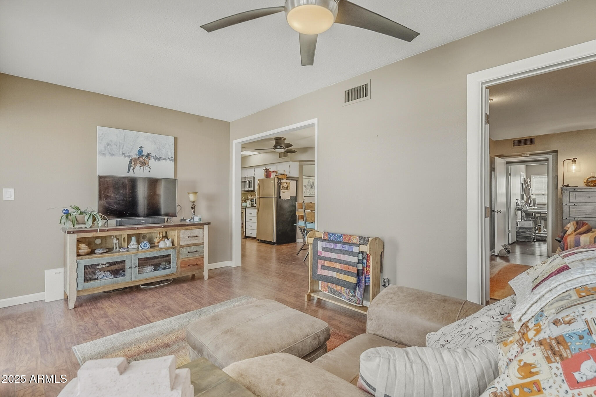 10010 West Royal Oak Road, Unit R Sun City, AZ 85351 - Photo 13 of 28 a living room with furniture and a flat screen tv