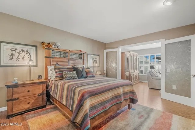 a bedroom with a large bed and a window