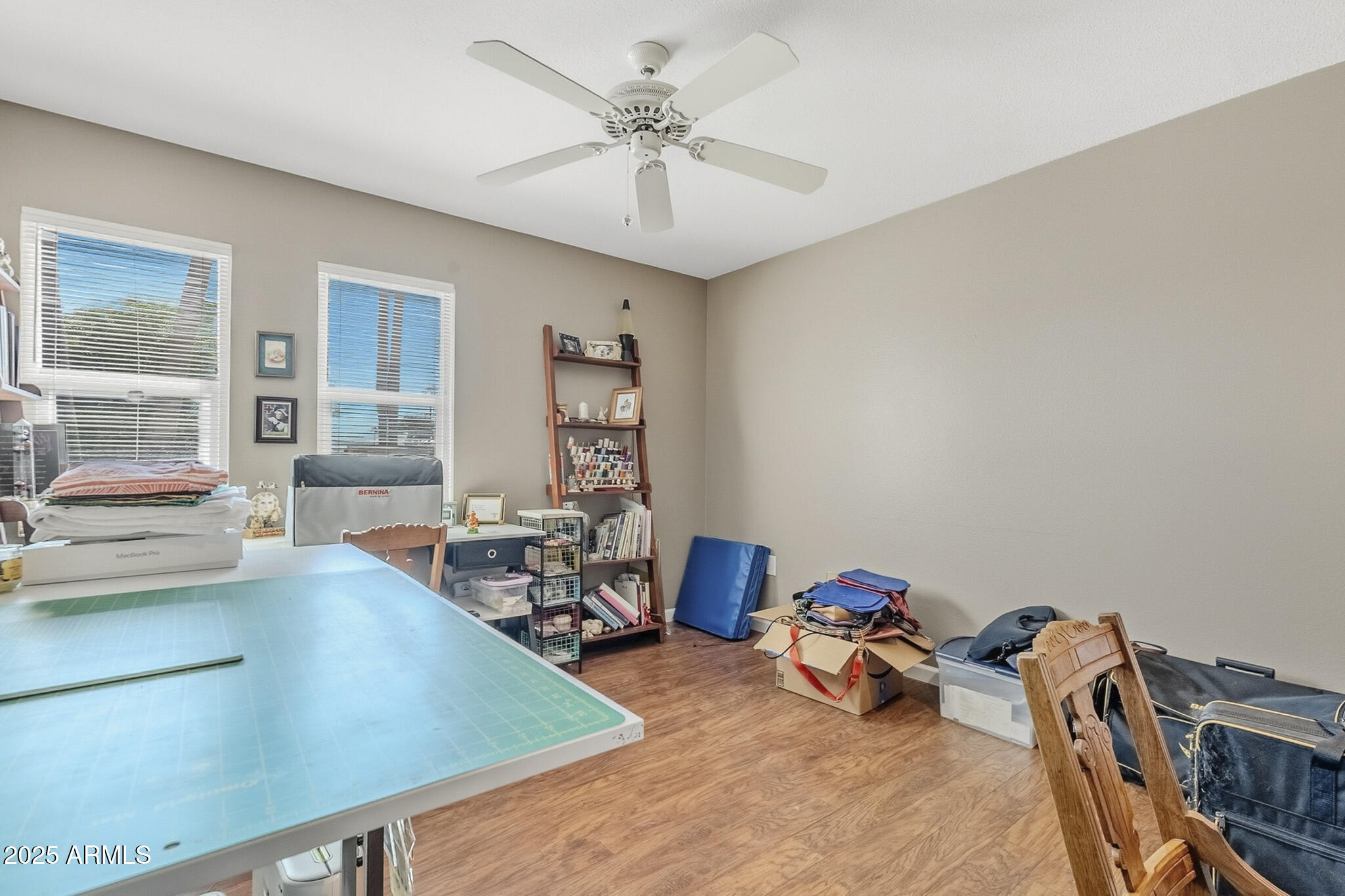 10010 West Royal Oak Road, Unit R Sun City, AZ 85351 - Photo 19 of 28 a room with furniture and a chandelier