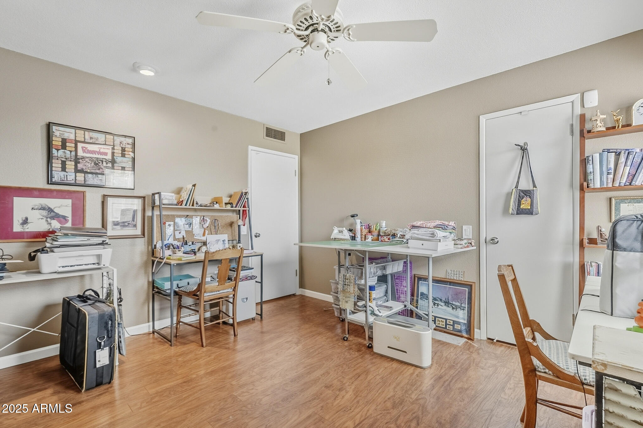 10010 West Royal Oak Road, Unit R Sun City, AZ 85351 - Photo 20 of 28 a view of a workspace with furniture and toys