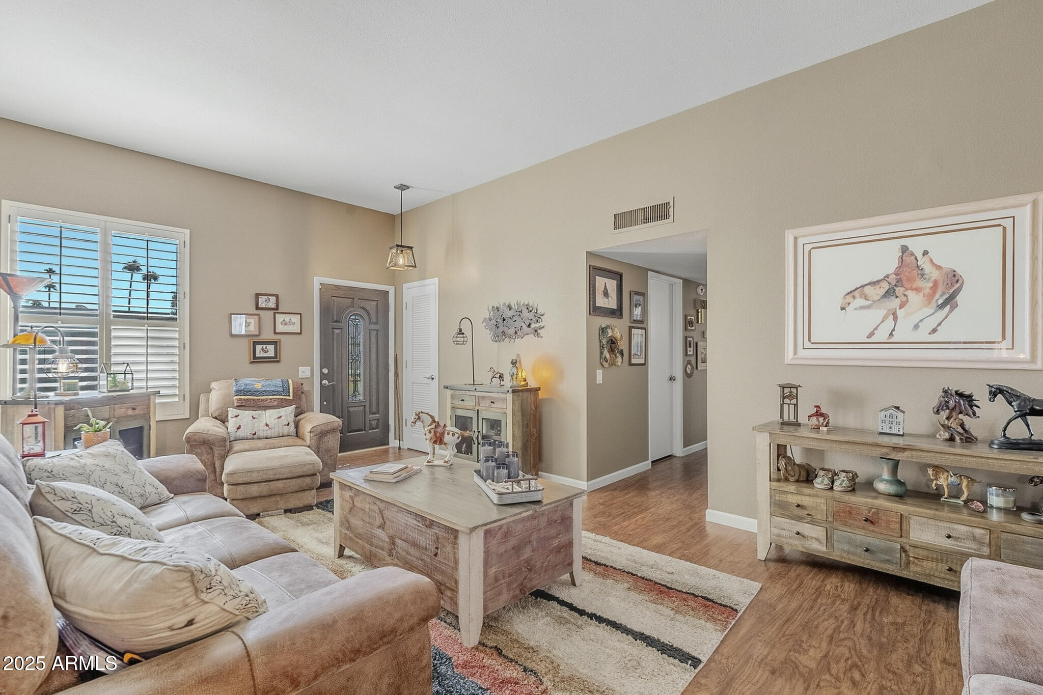 10010 West Royal Oak Road, Unit R Sun City, AZ 85351 - Photo 2 of 28 a living room with furniture and a flat screen tv
