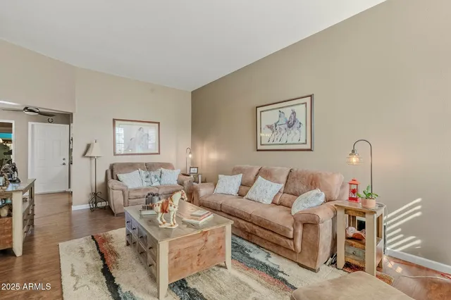 a living room with furniture and a table