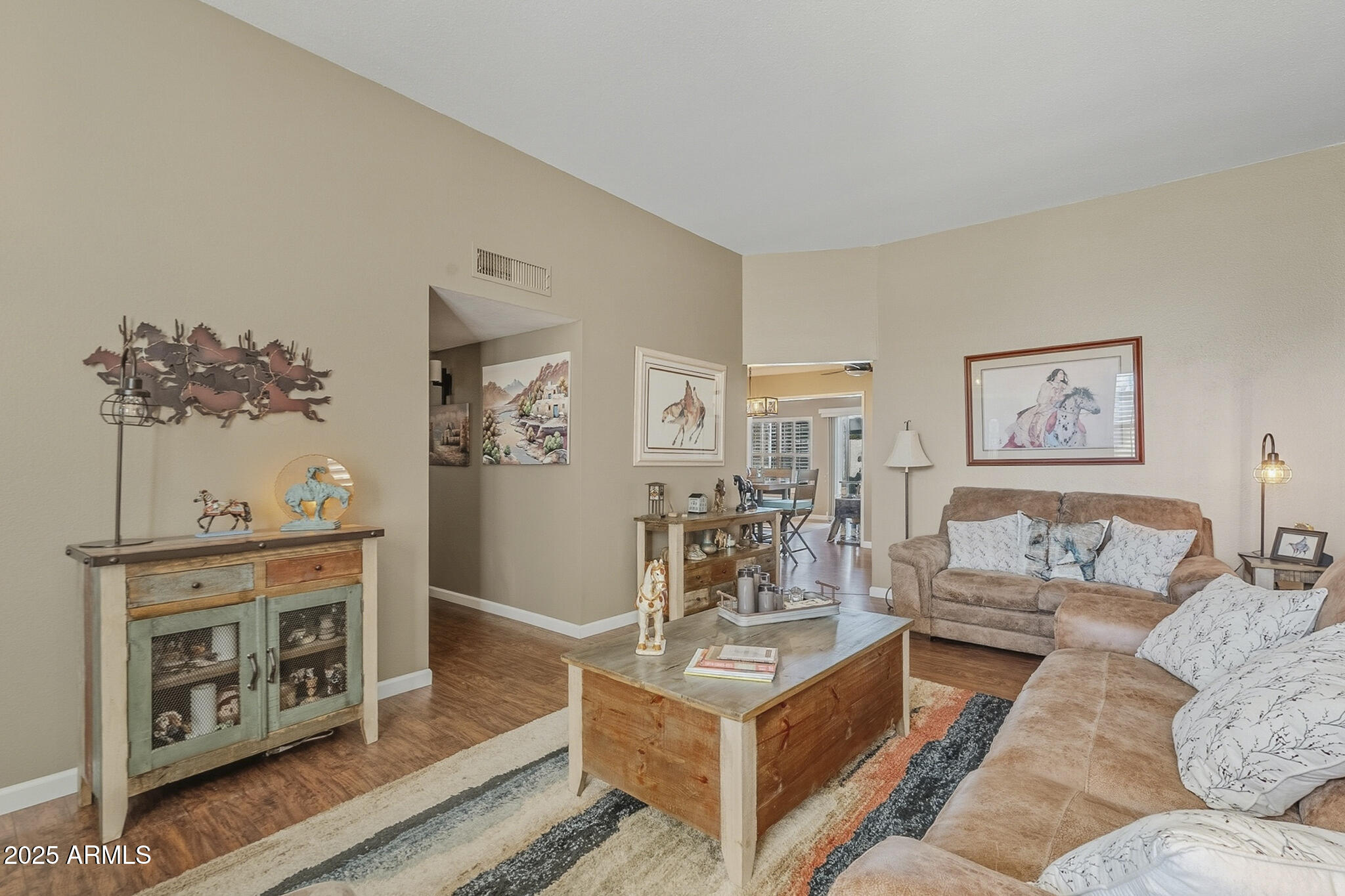 10010 West Royal Oak Road, Unit R Sun City, AZ 85351 - Photo 7 of 28 a living room with furniture and a fireplace