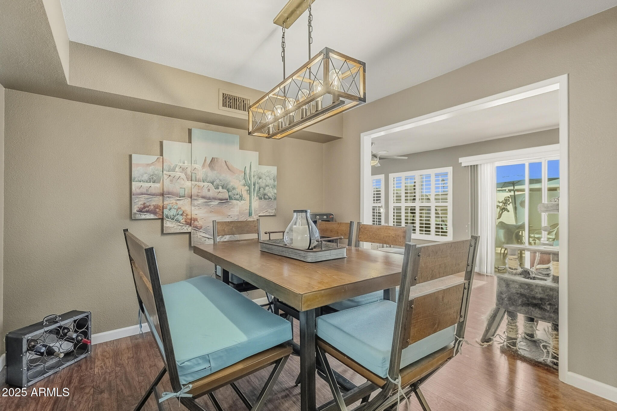 10010 West Royal Oak Road, Unit R Sun City, AZ 85351 - Photo 8 of 28 a view of a dining room with furniture and wooden floor