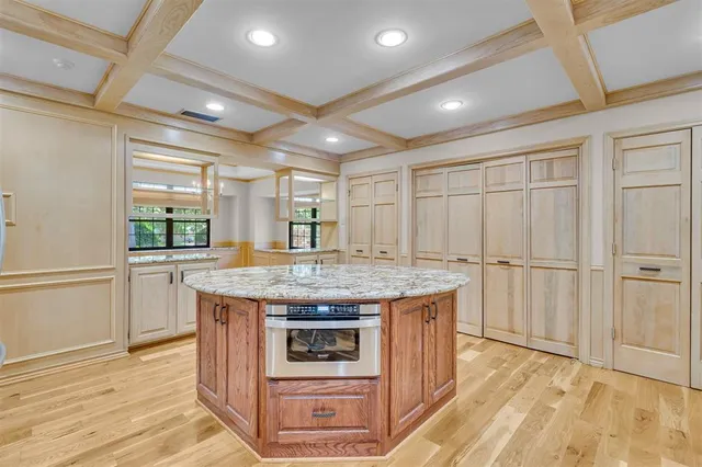a kitchen with a stove and a refrigerator