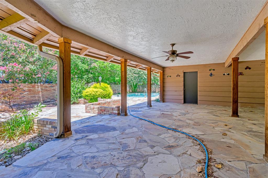 7019 Spring Valley Road Dallas, TX 75254 - Photo 16 of 19 a view of a porch with a table and chairs in the patio