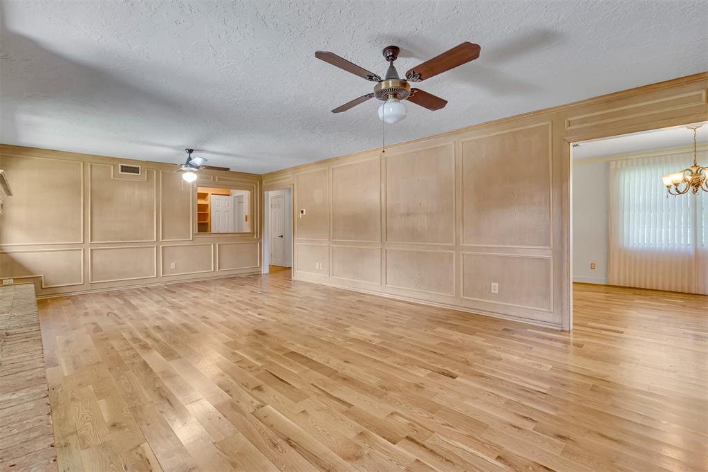 7019 Spring Valley Road Dallas, TX 75254 - Photo 6 of 19 a view of a livingroom with a ceiling fan