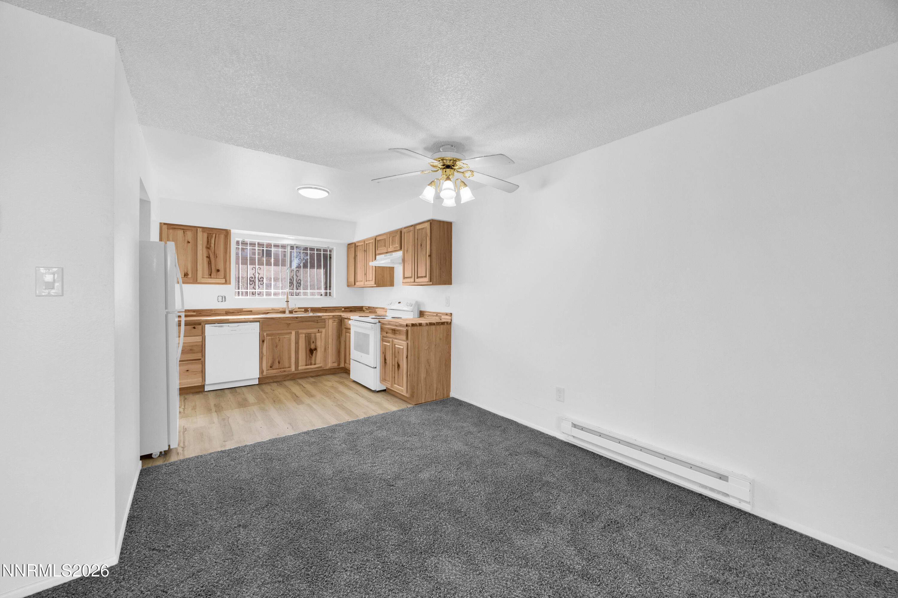 577 Smithridge Park Reno, NV 89502 - Photo 14 of 31 a view of a kitchen with a sink cabinets and a window