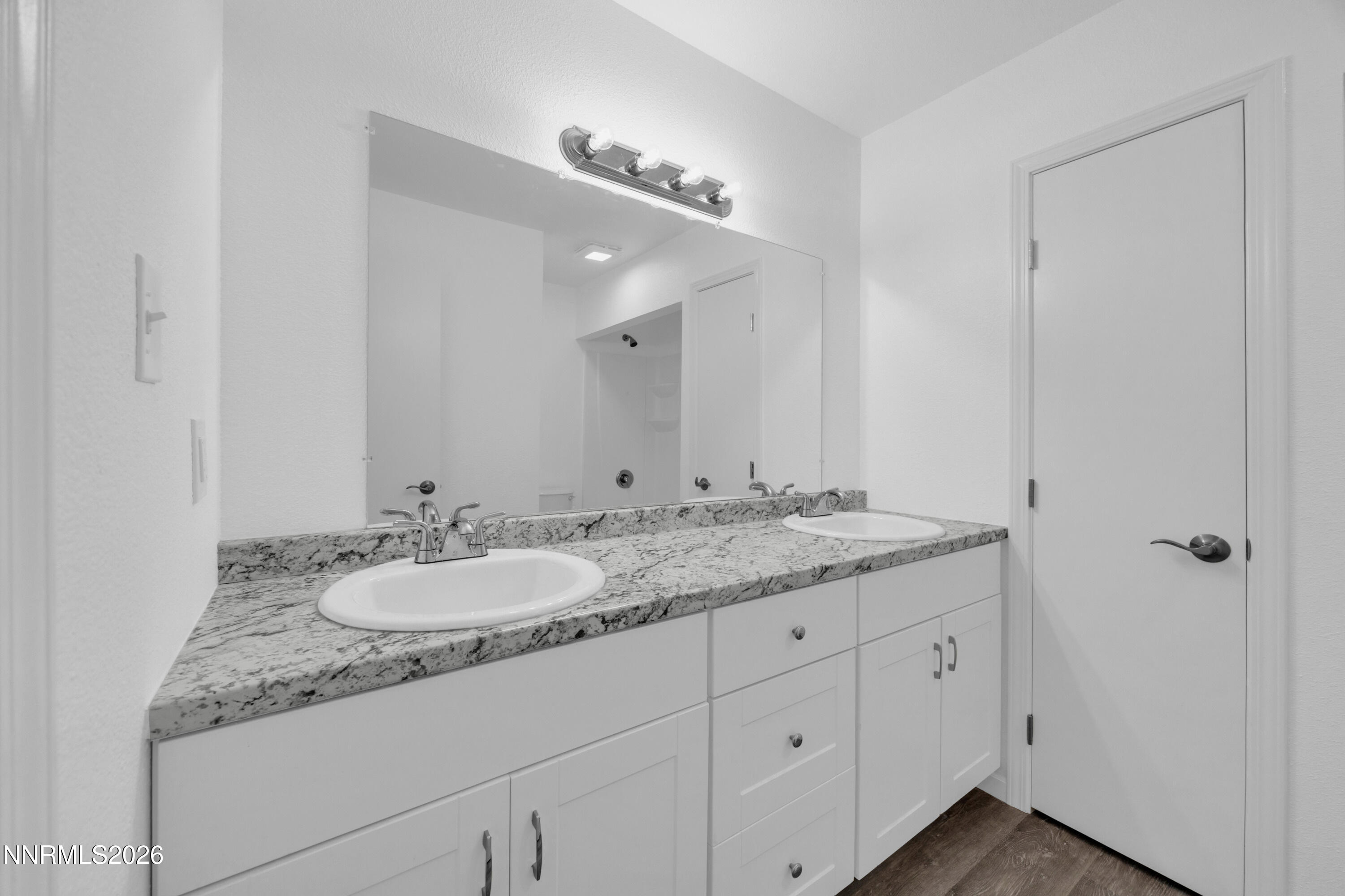 577 Smithridge Park Reno, NV 89502 - Photo 22 of 31 a bathroom with a granite countertop double sink and a mirror
