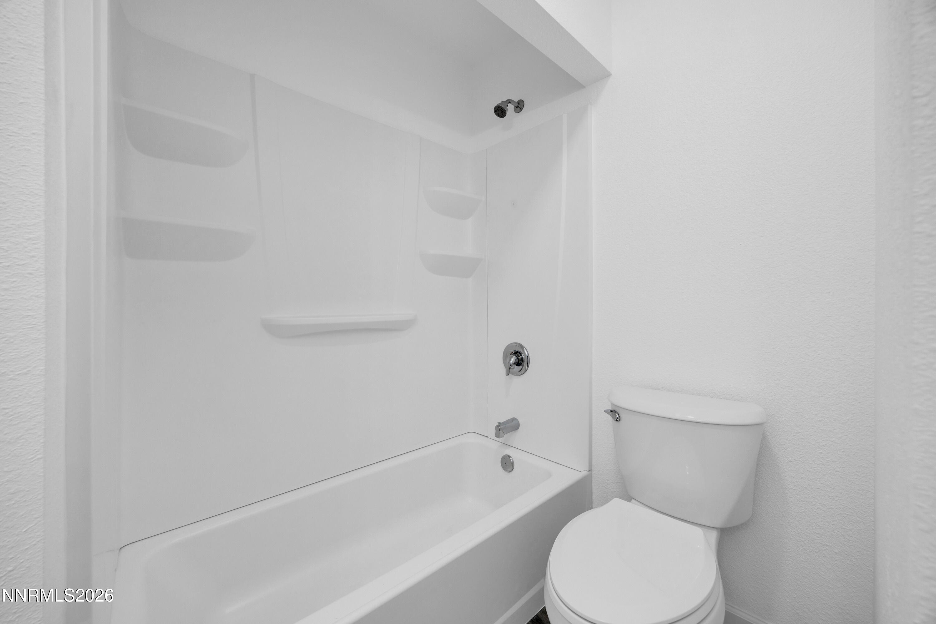 577 Smithridge Park Reno, NV 89502 - Photo 23 of 31 a white toilet sitting next to a bath tub