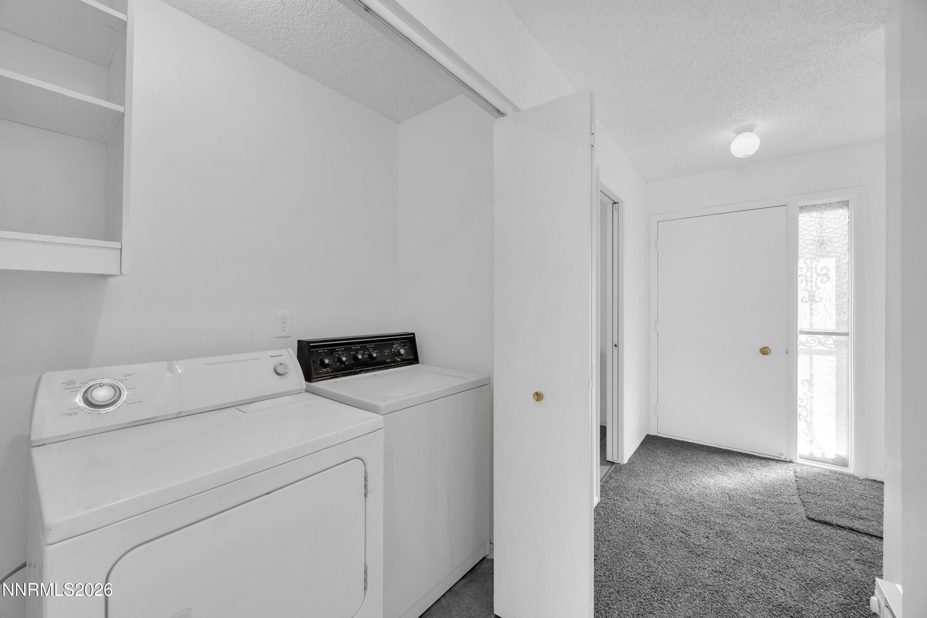 577 Smithridge Park Reno, NV 89502 - Photo 26 of 31 a view of washer and dryer with bathroom in the background