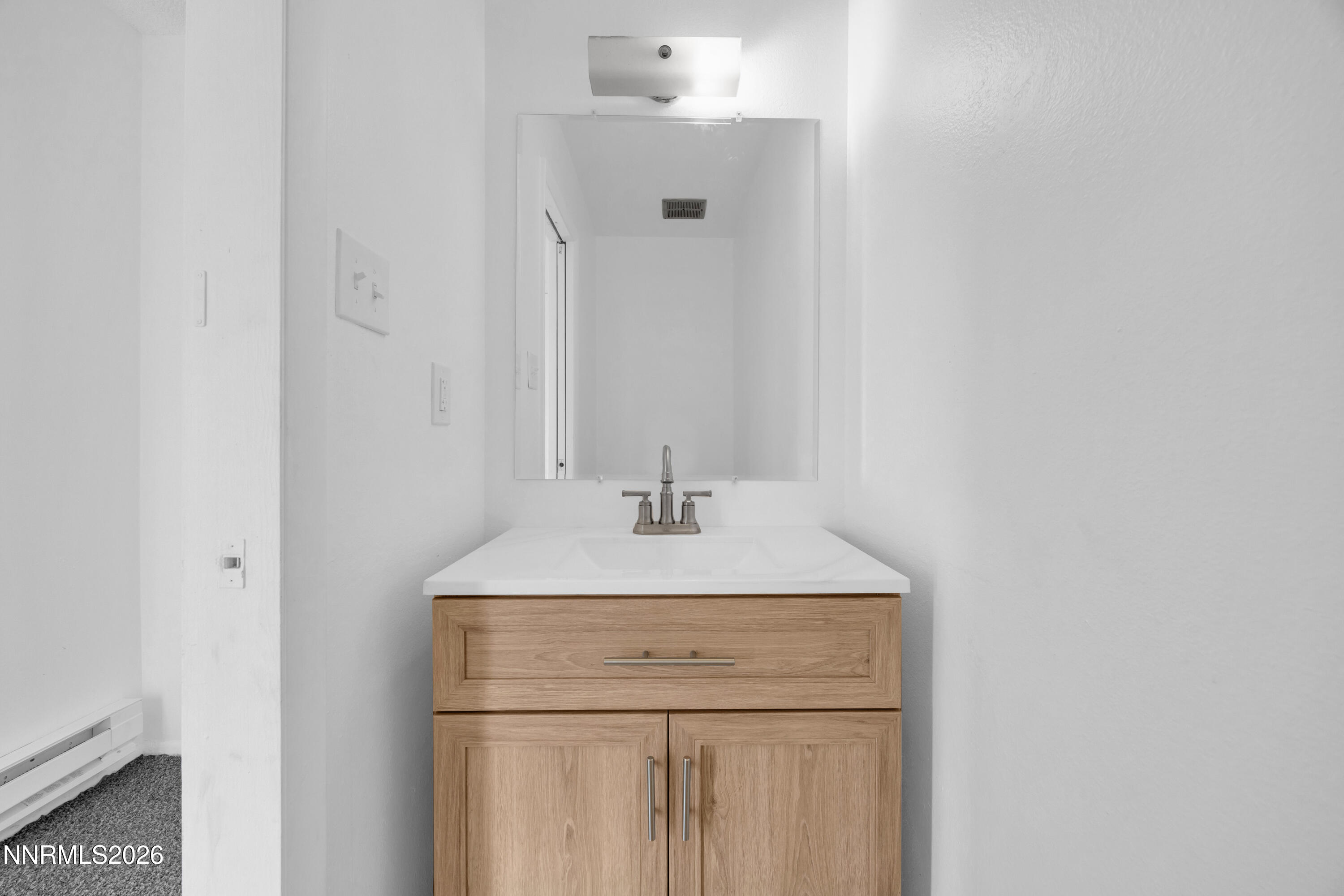 577 Smithridge Park Reno, NV 89502 - Photo 27 of 31 a bathroom with a sink and a mirror