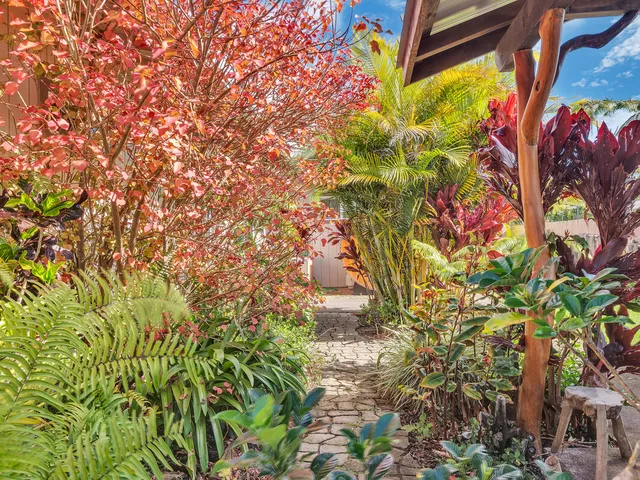 a view of a patio with a table and chairs