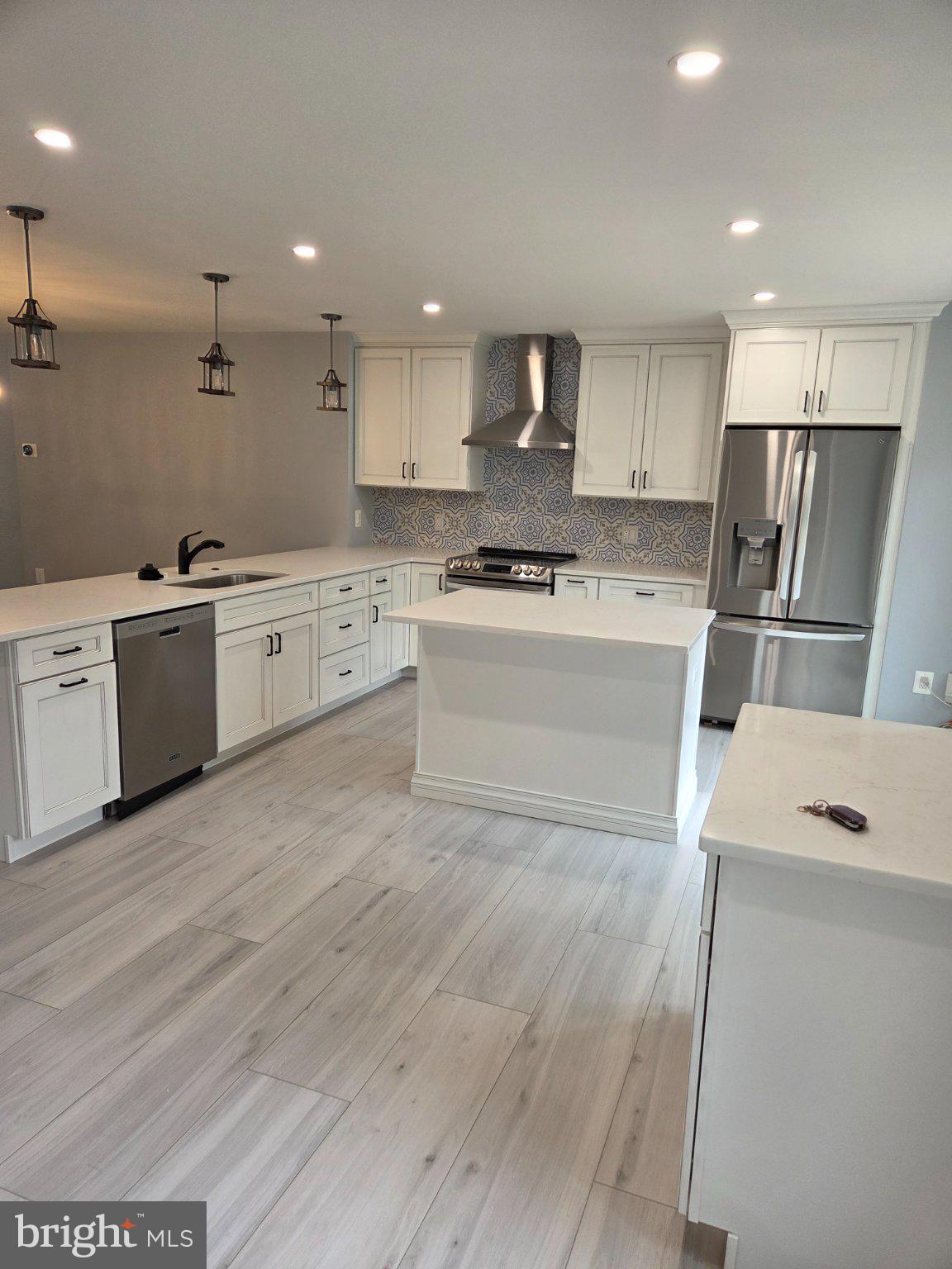7229 Olde Lantern Way Springfield, VA 22152 - Photo 27 of 32 Modern kitchen with sleek finishes.