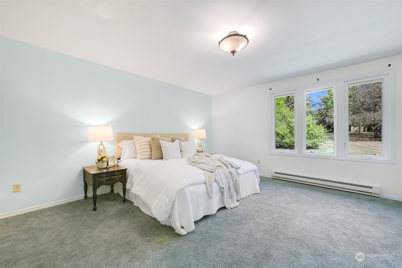 6366 Mission Road Everson, WA 98247 - Photo 21 of 40 a bed room with a bed and a lamp