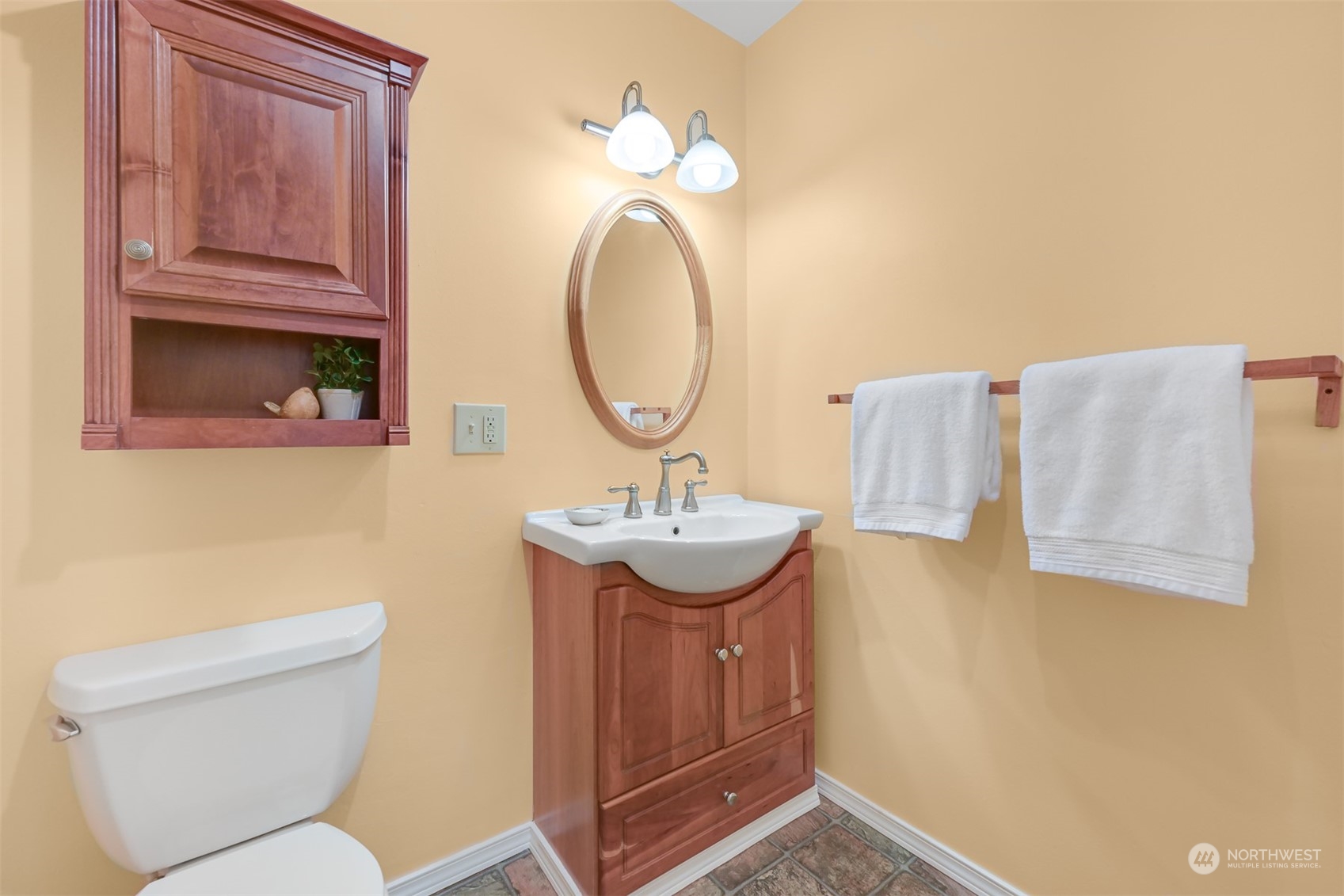 6366 Mission Road Everson, WA 98247 - Photo 24 of 40 a bathroom with a toilet sink and mirror